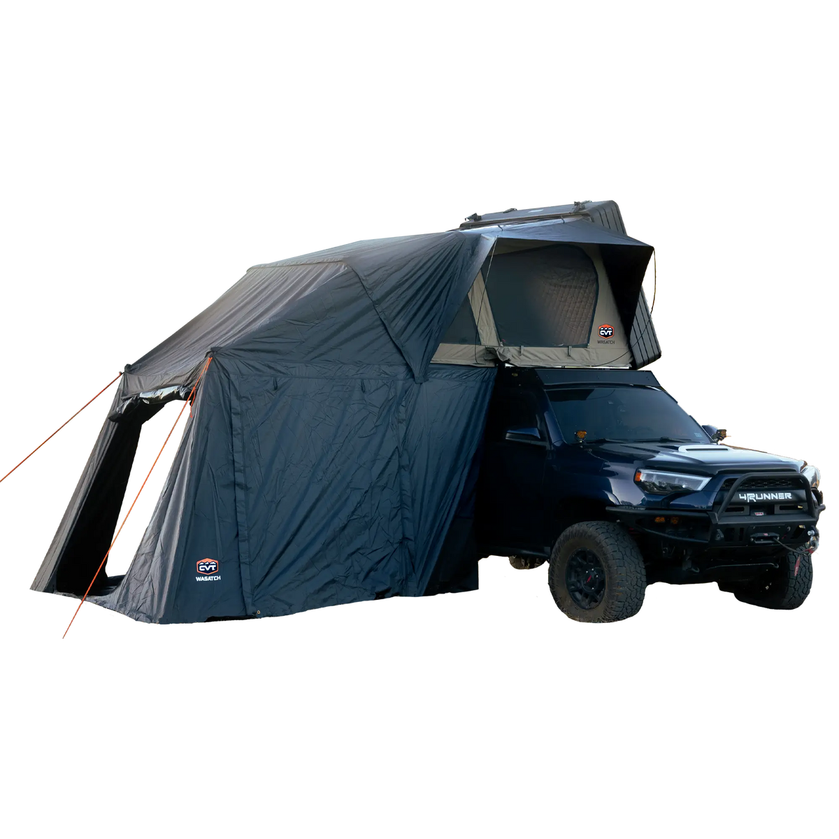A dark-colored SUV featuring a CVT Wasatch Annex rooftop tent with an attached awning shelter, fully set up for camping on a light background. The Wasatch Annex by CVT extends from the tent over the side of the vehicle to the ground, providing rugged protection and creating a spacious camping shelter.