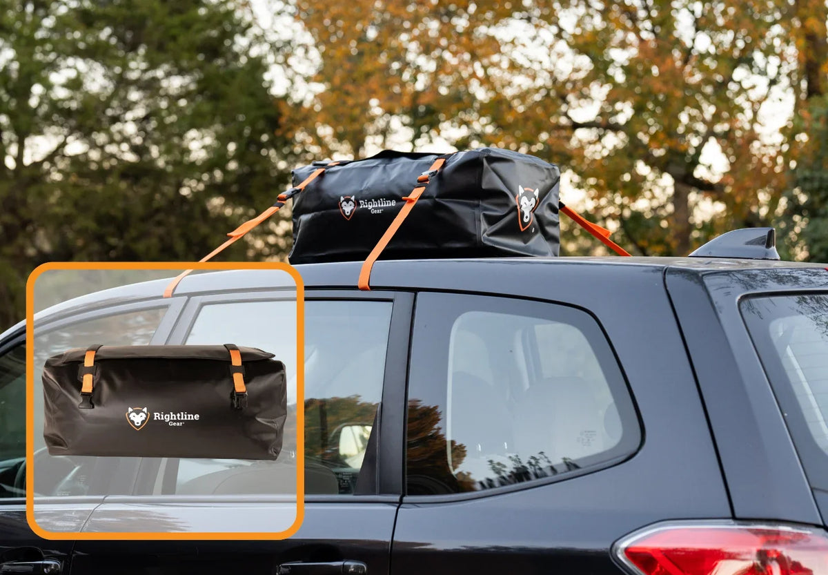 A black car with a black Rightline rooftop cargo bag secured on top with orange straps. Inset shows a close-up of the cargo bag. Trees with autumn foliage are in the background.