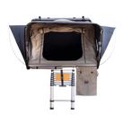 A CVT Wasatch Hardshell Tent is displayed against a plain white background, featuring an open entrance, two side flaps extended, and a collapsible ladder leading up to the tent—ideal for your next overland adventure. A storage pouch hangs on the right side.