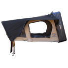 Side view of the CVT Wasatch Hardshell Tent mounted on a platform, featuring a zippered entrance, extended canopy, and sturdy support ladders—ideal for camping on vehicles and perfect for your next overland adventure.