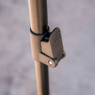 Close-up of a metallic pole featuring a hinged clamp lock mechanism, part of the CVT 180 Degree Awning—engineered to deliver instant shade and reliable outdoor shelter—shown against a softly blurred, neutral background.