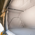 Interior view of a tent featuring the CVT La Sal Insulation Walls, with quilted, padded walls and ceiling that showcase the insulated liner designed to enhance warmth and comfort during winter camping. The empty space highlights the stitching and structure of the tent’s insulation system.
