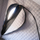 A close-up of the CVT Mt. Hood Insulation Walls installed inside a tent, featuring quilted gray fabric and a round zippered window partially open to let in light—demonstrating how this insulated liner is designed to enhance warmth for cold-weather camping.