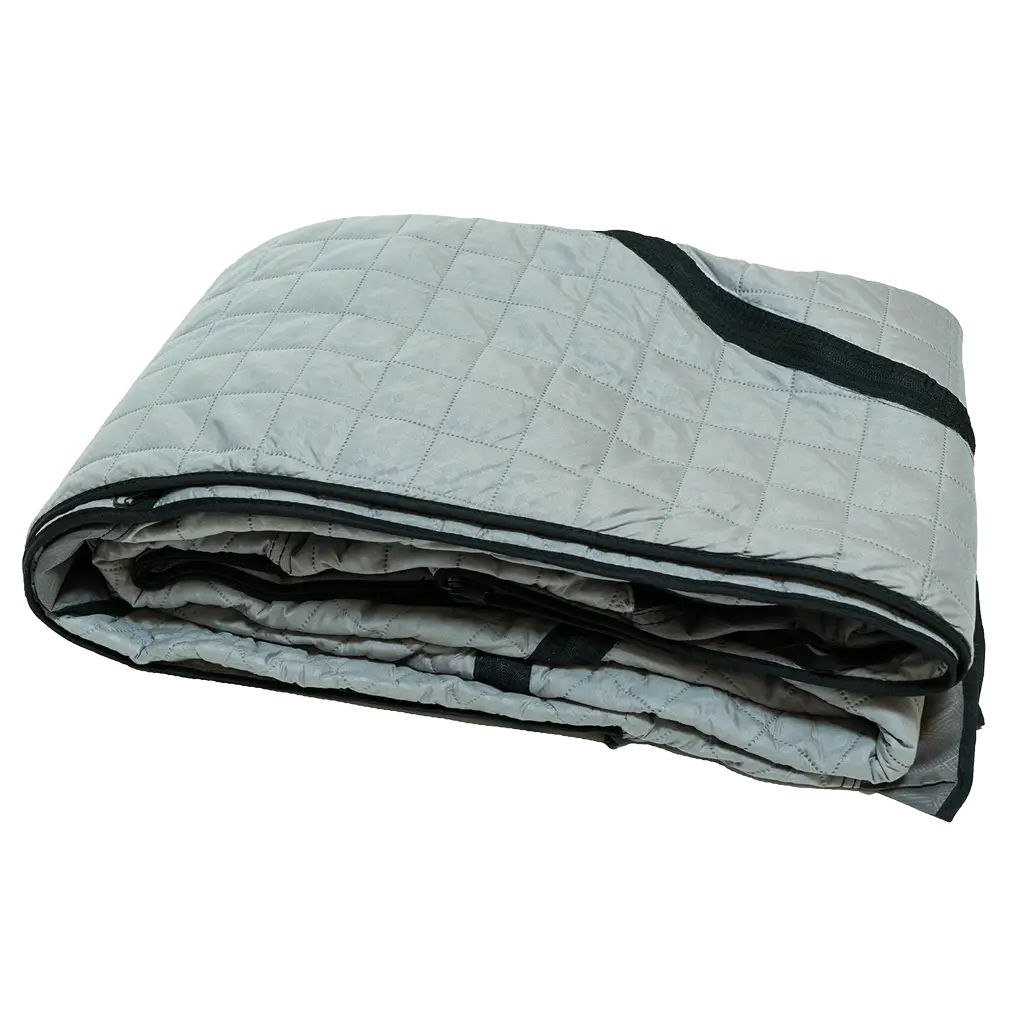 A folded, light gray quilted Pioneer Insulation Wall by CVT with black trim lies on a white background—perfect for boosting insulation in cold weather camping or increasing comfort inside Pioneer tents.