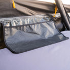 Close-up of a mesh storage pocket with a topographic pattern inside the CVT Pioneer 2 Softshell Tent, attached to the tent wall above a sleeping pad—perfect for keeping essentials organized during overland adventures.