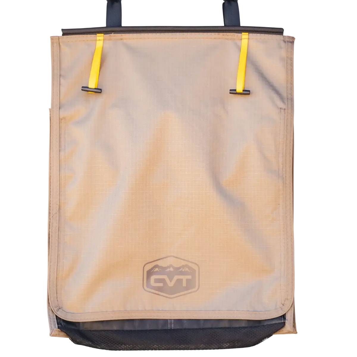 The Mt. Hood/La Sal Shoe Bag by CVT is a tan hanging gear bag featuring two yellow straps at the top, a mesh pocket at the bottom, and a front logo with mountains and “CVT”. Designed as an ideal rooftop tent shoe organizer, this CVT shoe bag keeps your footwear neatly stored while camping. The background is white.