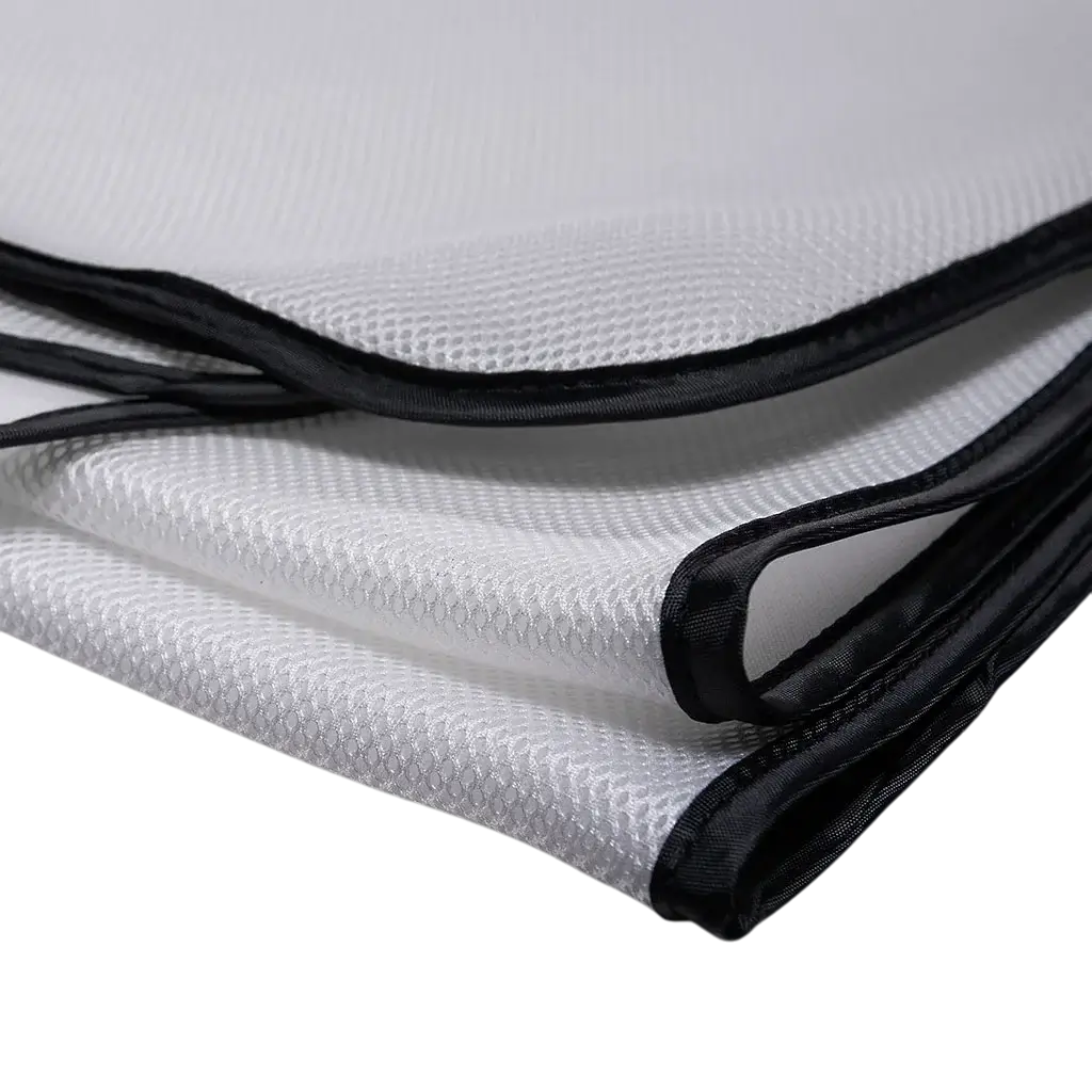 Close-up of the CVT Anti Condensation Mat, featuring folded white mesh fabric with black trimmed edges against a white background. The detailed texture of the mesh and precise stitching on the trim emphasize its effectiveness as an anti condensation solution for softshell tents.