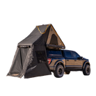 A black pickup truck is shown isolated on a white background, equipped with a CVT Mt. Hood Annex tent and an extended fabric annex for outdoor gear storage.