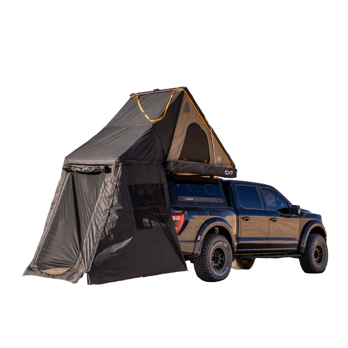 A black pickup truck is shown isolated on a white background, equipped with a CVT Mt. Hood Annex tent and an extended fabric annex for outdoor gear storage.