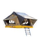 The CVT Pioneer 2 Softshell Tent is ideal for overland adventures, showcasing a black rainfly, beige sides, open windows, and a yellow base. This soft-shell tent mounts on a metal frame and includes a ladder for easy access, all set against a plain white background.