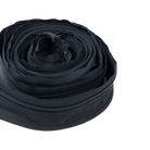 A close-up of a coiled black CVT Pioneer Zipper Strip on a white background, highlighting its weatherproof seal—perfect for rooftop tent applications.