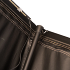 Close-up of a black metal CVT Mt. Hood/La Sal Stabilizer Interior Pole attached to black fabric with visible stitches and a hook, alongside an electrical wire, set against a plain light background—engineered for enhanced stability in CVT’s hardshell rooftop tents.